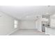 Open layout living area with integrated kitchen boasting stainless steel appliances offers modern living at 9266 Sw 58Th Cir, Ocala, FL 34476