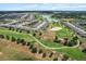 Community golf course and residential area, with a pond at 9459 Sw 52Nd Loop, Ocala, FL 34481