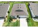 Aerial view of the home, highlighting its landscaping and roof at 9459 Sw 52Nd Loop, Ocala, FL 34481