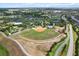 Aerial view of a community baseball field and recreational facilities at 9459 Sw 52Nd Loop, Ocala, FL 34481