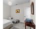Bright bedroom featuring neutral walls, a cozy daybed, and stylish accent pieces at 9459 Sw 52Nd Loop, Ocala, FL 34481