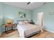 Cozy bedroom with light blue walls, hardwood floors, and stylish decor at 9459 Sw 52Nd Loop, Ocala, FL 34481