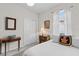 Comfortable bedroom with white bedding and curtains, complemented by stylish decor at 9459 Sw 52Nd Loop, Ocala, FL 34481