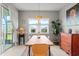 Bright dining room with modern table and chairs, and a view of the outdoors at 9459 Sw 52Nd Loop, Ocala, FL 34481