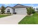 Charming single-story home with a well-manicured lawn and a two-car garage at 9459 Sw 52Nd Loop, Ocala, FL 34481