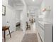 Well-lit hallway with neutral tones, leading to the bedrooms and living spaces at 9459 Sw 52Nd Loop, Ocala, FL 34481