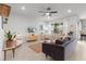 Bright living room with tile floors, comfortable seating, and a large window view at 9459 Sw 52Nd Loop, Ocala, FL 34481