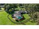 Aerial view of the property with a screened pool, fenced yard, and mature landscaping at 9462 Sw 72Nd Ct, Ocala, FL 34476