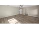 Bright bedroom with wood-look flooring and white walls with a ceiling fan at 9462 Sw 72Nd Ct, Ocala, FL 34476