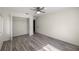 This bedroom features tile floors, a ceiling fan, and a closet for ample storage at 9462 Sw 72Nd Ct, Ocala, FL 34476