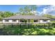 Charming one-story home featuring a brick foundation, neutral paint, shutters, and a well-manicured lawn at 9462 Sw 72Nd Ct, Ocala, FL 34476