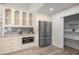A modern kitchen features stainless steel appliances, pantry, and custom cabinetry at 9462 Sw 72Nd Ct, Ocala, FL 34476