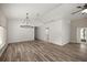 Spacious living area featuring an open concept and wood-look floors and neutral paint at 9462 Sw 72Nd Ct, Ocala, FL 34476