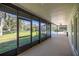 Spacious screened lanai offers views of the backyard, pool and lush landscape at 9462 Sw 72Nd Ct, Ocala, FL 34476
