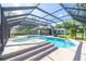 Beautiful pool area in screened in lanai, with lush landscaping, ample seating, and pool at 9462 Sw 72Nd Ct, Ocala, FL 34476