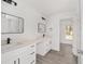 Modern bathroom with double vanity, black fixtures, and ample counter space at 9731 Bahia Rd, Ocala, FL 34472