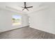 Bright bedroom with ceiling fan and natural light streaming in from a window at 9731 Bahia Rd, Ocala, FL 34472