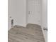 Neutral entryway featuring luxury vinyl plank flooring, neutral paint, and exterior door at 9731 Bahia Rd, Ocala, FL 34472