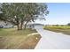 A single-story home with an attached two-car garage and a long driveway at 9731 Bahia Rd, Ocala, FL 34472