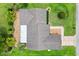 Overhead view of home with landscaped yard, roof, and driveway at 9853 Se 175Th Pl, Summerfield, FL 34491