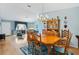 Bright dining room with hardwood floors, ample seating, and classic decor for memorable gatherings at 9853 Se 175Th Pl, Summerfield, FL 34491