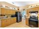 Spacious kitchen with ample wood cabinets, granite counters and stainless steel appliances at 9853 Se 175Th Pl, Summerfield, FL 34491