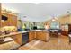 Bright kitchen boasts granite counters, stainless appliances, and an open floorplan at 9853 Se 175Th Pl, Summerfield, FL 34491