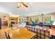 Open living room with high ceilings, ceiling fans and plenty of natural light at 9853 Se 175Th Pl, Summerfield, FL 34491