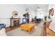 Inviting lounge with a brick fireplace, comfortable seating, and classic decor at 9853 Se 175Th Pl, Summerfield, FL 34491