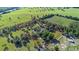 Sprawling property with trees and a defined boundary, offering a serene and private setting for a custom home or development at 10528 Sw 27Th Ave, Ocala, FL 34476