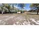 Expansive backyard with lush greenery and mature trees offering a serene and private outdoor space at 10528 Sw 27Th Ave, Ocala, FL 34476