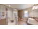 Bathroom featuring granite countertops, a glass-enclosed shower, and modern fixtures at 10528 Sw 27Th Ave, Ocala, FL 34476