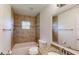 Updated bathroom features granite countertops, tiled tub/shower, and modern fixtures at 10528 Sw 27Th Ave, Ocala, FL 34476