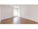 Inviting bedroom offers hardwood floors, ceiling fan, and bright, sheer curtains at 10528 Sw 27Th Ave, Ocala, FL 34476