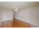 Light-filled bedroom has hardwood floors, ceiling fan, and closet at 10528 Sw 27Th Ave, Ocala, FL 34476