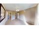 A neutral-toned bedroom features tile flooring, a ceiling fan, and two doorways at 10528 Sw 27Th Ave, Ocala, FL 34476
