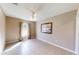 Bright, neutral bedroom with tile flooring, a ceiling fan, and window coverings at 10528 Sw 27Th Ave, Ocala, FL 34476
