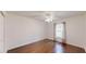 Cozy bedroom with hardwood floors, ceiling fan, and natural light at 10528 Sw 27Th Ave, Ocala, FL 34476