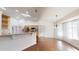Dining area featuring open layout, hardwood floors and connection to the kitchen at 10528 Sw 27Th Ave, Ocala, FL 34476