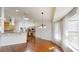 Bright dining area with open layout, hardwood floors and large windows at 10528 Sw 27Th Ave, Ocala, FL 34476