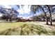 Beautiful exterior view of a home with a lush green lawn and mature shade trees at 10528 Sw 27Th Ave, Ocala, FL 34476