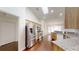 Well-lit kitchen with stainless steel appliances, wood floors and granite countertops at 10528 Sw 27Th Ave, Ocala, FL 34476