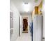 A well-lit laundry room with cabinets, tile floors, and included washer and dryer units at 10528 Sw 27Th Ave, Ocala, FL 34476