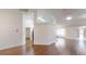 Bright, open-concept living area with hardwood floors, and a glimpse of the modern kitchen at 10528 Sw 27Th Ave, Ocala, FL 34476
