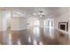 Spacious living room featuring hardwood floors, a fireplace, and an open layout for entertaining at 10528 Sw 27Th Ave, Ocala, FL 34476