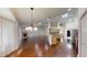 Spacious living room featuring wood floors, fireplace, open layout, and abundant natural light at 10528 Sw 27Th Ave, Ocala, FL 34476