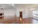 Open-concept living space with hardwood floors, fireplace, and natural light at 10528 Sw 27Th Ave, Ocala, FL 34476