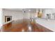 Living room with fireplace and view to entry, dining and kitchen areas at 10528 Sw 27Th Ave, Ocala, FL 34476