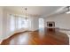 Bright living room with a fire place, hardwood floors and large bright windows at 10528 Sw 27Th Ave, Ocala, FL 34476