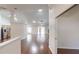 Bright and spacious living area featuring hardwood floors, white walls, and an open-concept design at 10528 Sw 27Th Ave, Ocala, FL 34476